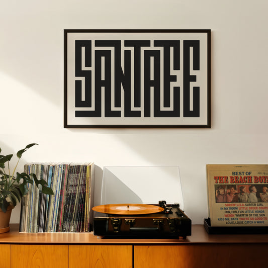 Retro Santa Fe artwork above vintage record player on Mid-Century Modern furniture.