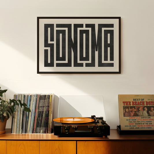 Retro Sonoma artwork above vintage record player on Mid-Century Modern furniture.