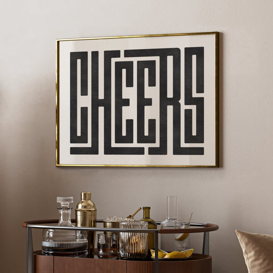 Trendy cocktail Cheers art print above bar cart