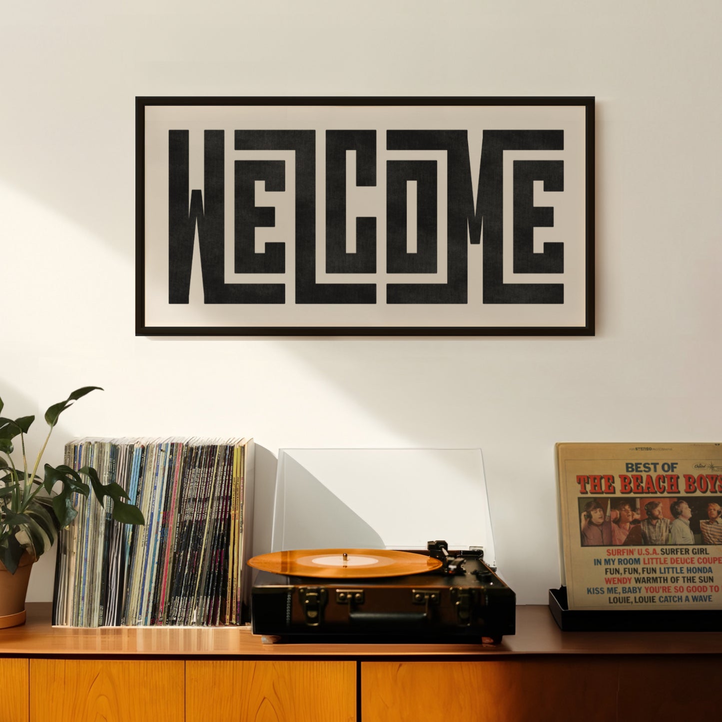 Wood framed minimalist Welcome Wall Decor in Boho style room wtih neutral colors