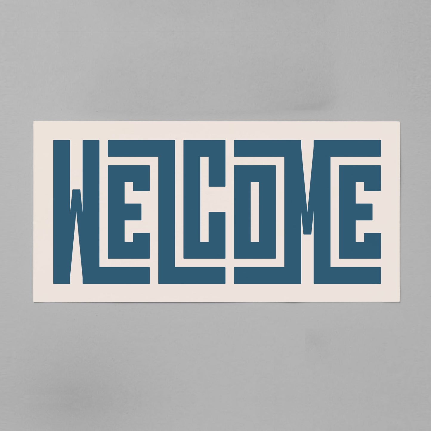Retro Welcome artwork above vintage record player on Mid-Century Modern furniture.