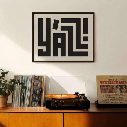 Retro Y'all artwork above vintage record player on Mid-Century Modern furniture.
