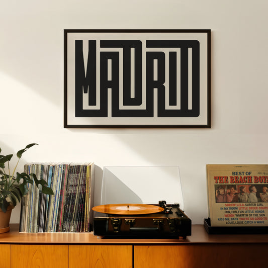 Retro Madrid artwork above vintage record player on Mid-Century Modern furniture.