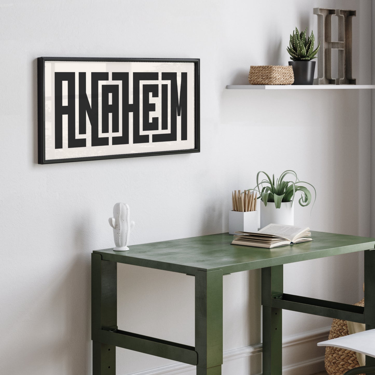 Personalized Anaheim art poster in Black Frame above desk in minimalist dorm room.