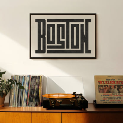 Retro Boston artwork above vintage record player on Mid-Century Modern furniture.
