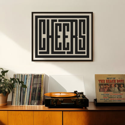 Retro Cheers artwork above vintage record player on Mid-Century Modern furniture.