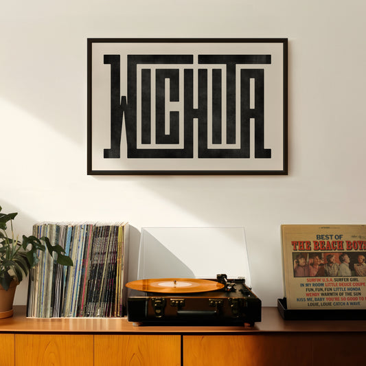 Retro Wichita artwork above vintage record player on Mid-Century Modern furniture.