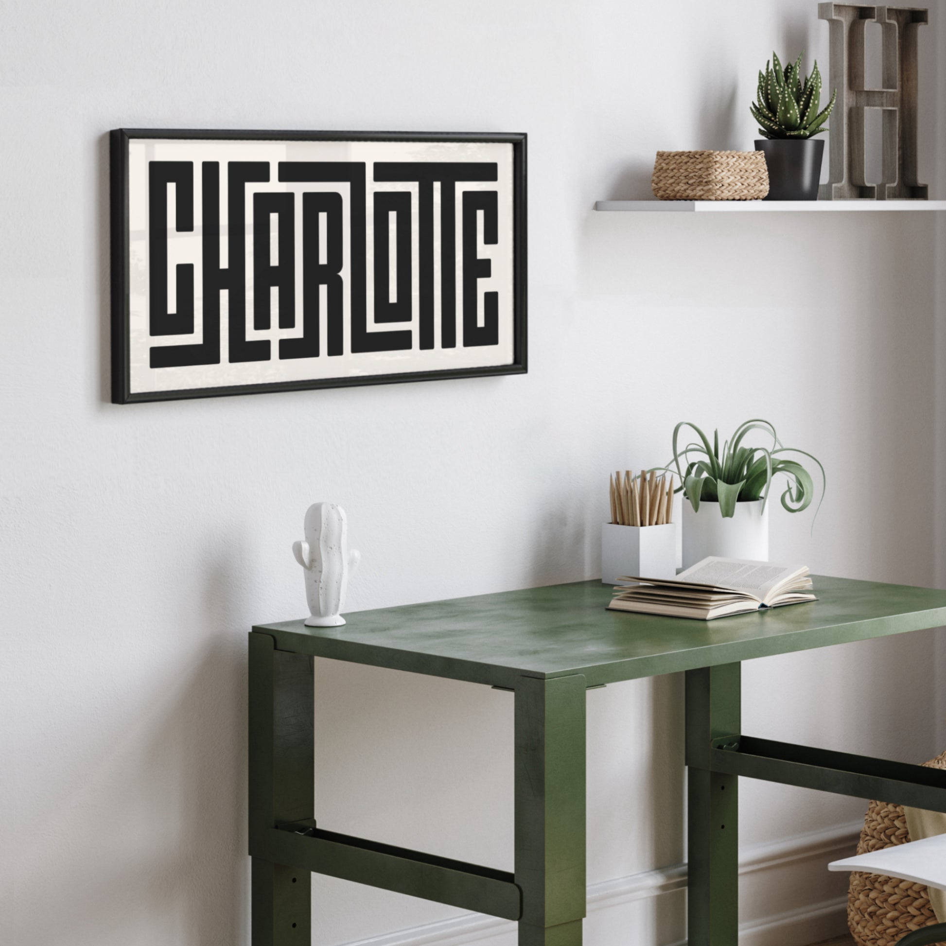 Personalized Charlotte poster in Black Frame above desk in minimalist dorm room.