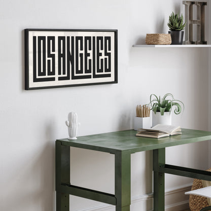 Personalized Los Angeles poster in Black Frame above desk in minimalist dorm room.