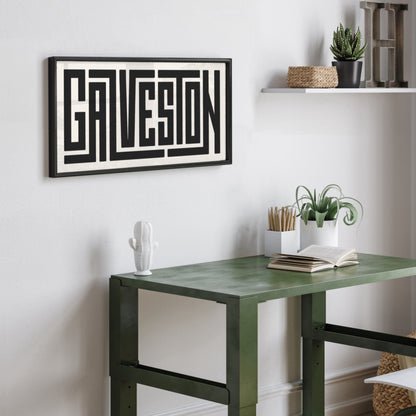 Personalized Galveston poster in Black Frame above desk in minimalist dorm room.