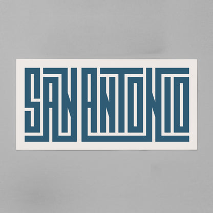 Personalized San Antonio poster in Black Frame above desk in minimalist dorm room.