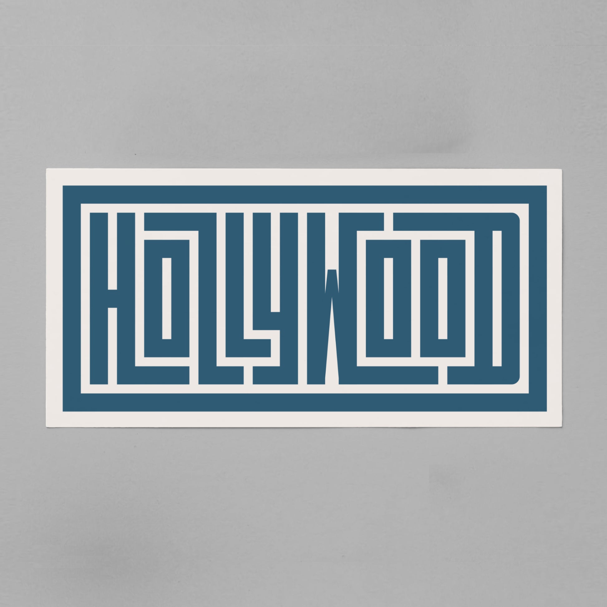 Personalized Hollywood poster in Black Frame above desk in minimalist dorm room.