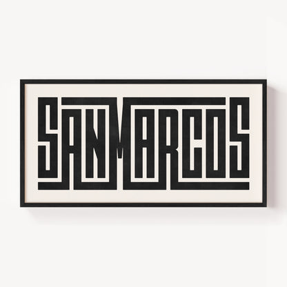 Framed artwork with 'SAN MARCOS' text on a white background